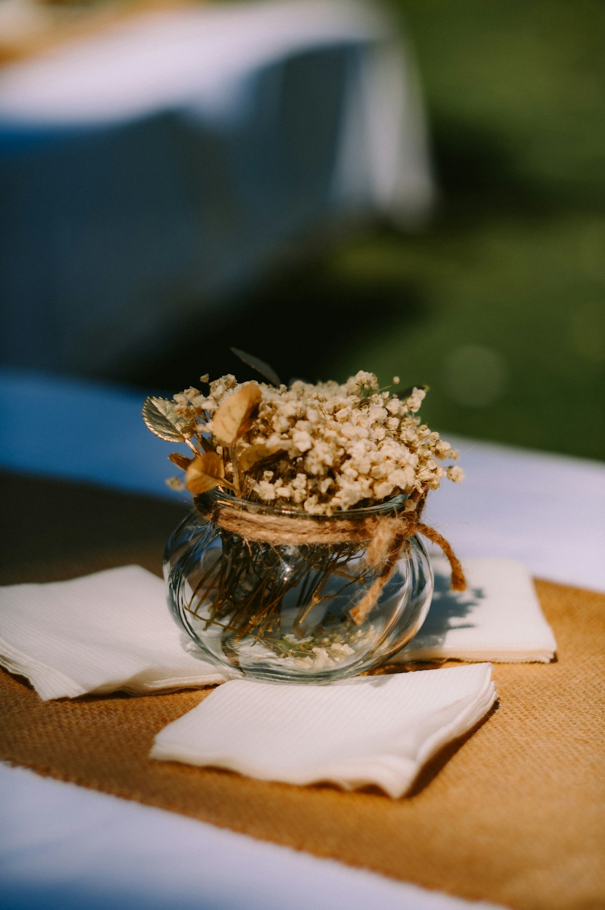 Rustic wedding table setting with elegant place settings and florals